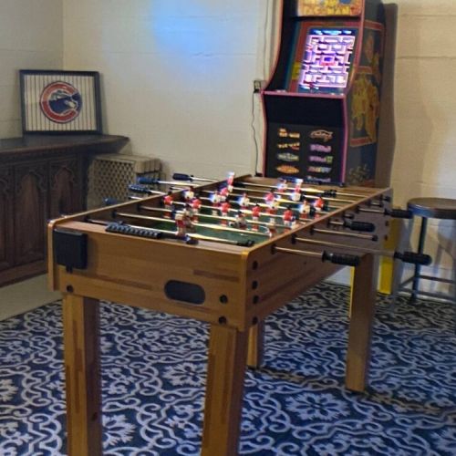 The game room includes foosball table, axe & dart throwing game, and a Mrs Pac-Man arcade  with 12 games.