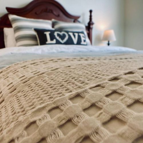 Each queen bedroom has additional standard pillows and an extra blanket at the foot of the bed.