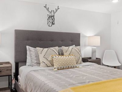 Queen-sized comfort in the basement room offers unparalleled relaxation to wake up refreshed and rejuvenated, ready to seize the day ahead.