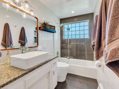 Experience the luxury and style in our newly remodeled full bath. Indulge in the spaciousness, sleek finishes and elegant fixtures modern design.