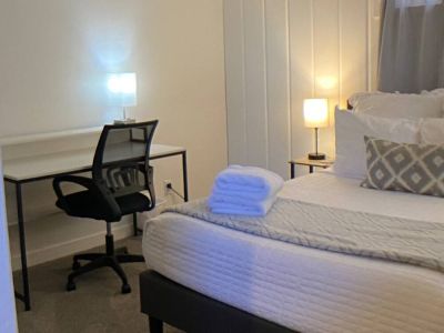 Full size bed with a full size office desk and ergonomic chair ensures comfort whether working or sleeping.