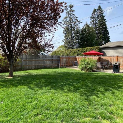 The spacious backyard is fully fenced-great for kids and pets to play