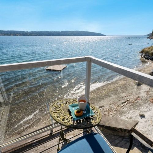 A private balcony extends from the  Loft King bedroom, inviting you to step outside and breathe in the salty sea air.