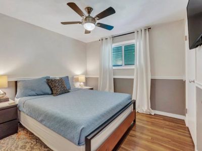 Experience comfort and coziness with an array of plush pillows and soft blankets in our inviting queen bedroom. It's equipped with a smart TV, providing entertainment and relaxation at your fingertips.