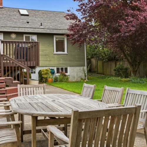 Dine al fresco while gathered around the aged teak outdoor dining-seats 8