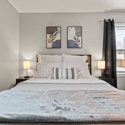 Slumber in Queen comfort with extra pillows and blankets.