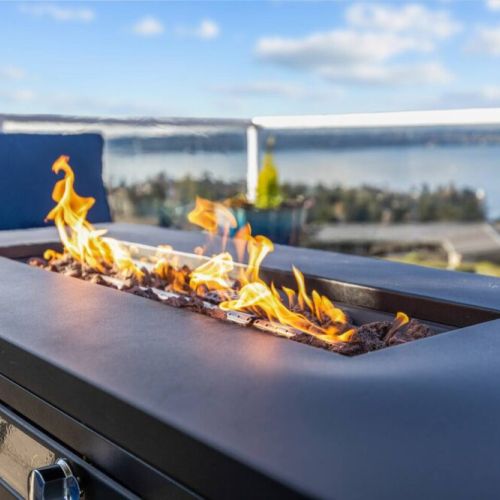 Lounge by the elongated fire pit with breathtaking views of Commencement Bay, Browns Point Lighthouse, Vashon Island, and the Olympic Mountains