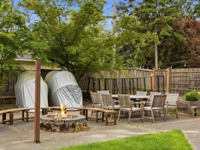 The outdoor fire pit has 4 moveable curved benches to enjoy the warmth