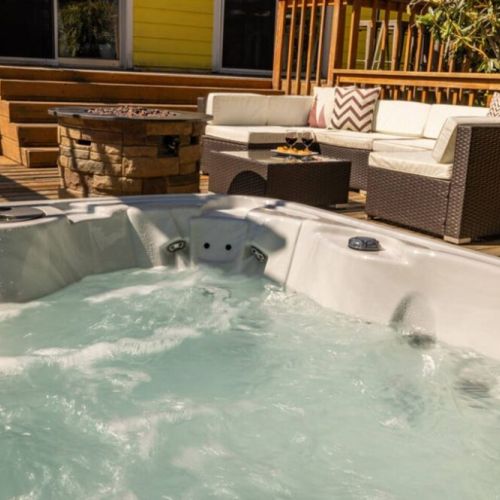 Unwind after a day full of adventure while soaking in the hot tub in the spacious backyard,