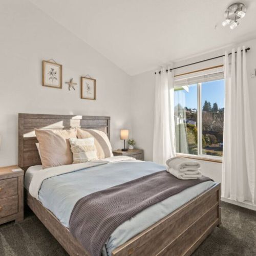 Sink into comfort in this Main Level Queen Bedroom-guests love our 5-star mattresses.