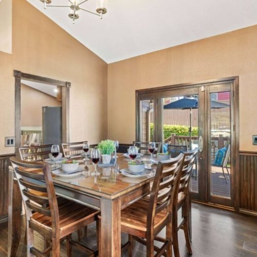 Gather and dine in style in this elegant dining room, showcasing a beautiful table and chairs set for a memorable dining experience.