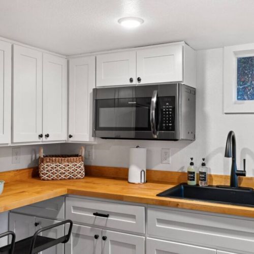 This well-appointed kitchen is equipped with everything you need to prepare meals and entertain guests, providing flexibility and convenience.