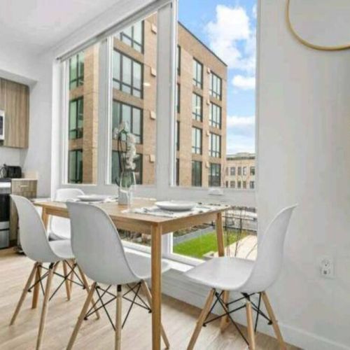 As daylight spills through the window. This dining table becomes a stage for shared moments and culinary delights.