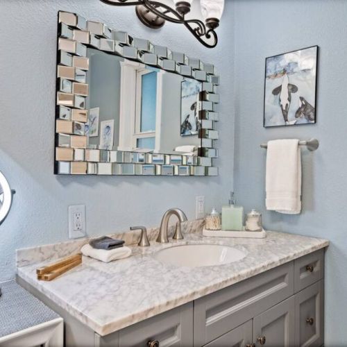 Step into this well-lit full bathroom on the main floor, where every detail has been carefully considered to provide a complete and luxurious bathing experience.