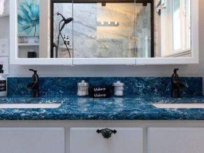 King En Suite bathroom with double vanities and a sky light.