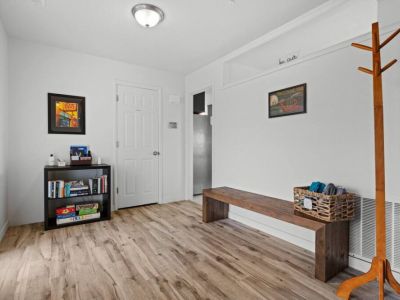 The entryway glows with abundant natural light, creating a warm and inviting atmosphere. Welcome to your home away from home!