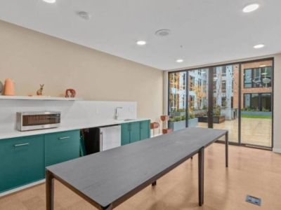 The community kitchen is connected to the rooftop deck.