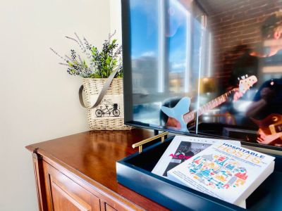 Enjoy watching your favorite shows and movies on the 50" Smart TV or peruse the book of art by Kevin Max...or read a chapter in the book that I co-authored.

Sit. Stay.  Relax.