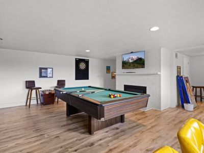 An inviting pool table stands in the center. A great way to bond with friends and family.