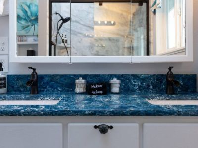 King En Suite bathroom with double vanities and a sky light.