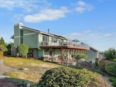 Waterview Haven has an upper deck and a lower covered patio, both with water views, and is currently unfenced.