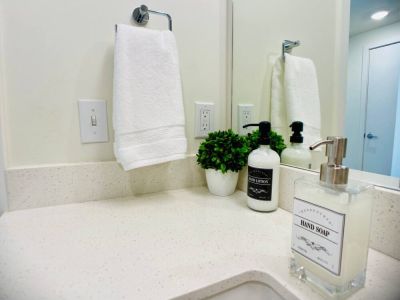 Amenities include 100% natural soaps and lotion, plush hygrocotton bath and hand towels, washcloths, and makeup cloths.