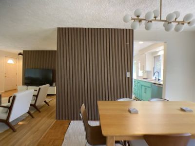 Enjoy meals in around the dining room table with seating for 6-8.