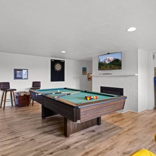 An inviting pool table stands in the center. A great way to bond with friends and family.