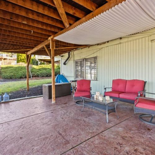 Patio provides additional outdoor space to hang out and play outdoor games