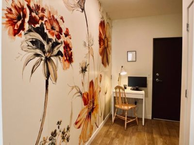 Entry way includes the workstation, coat rack, and full length mirror.