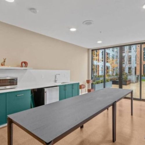 The community kitchen is connected to the rooftop deck.
