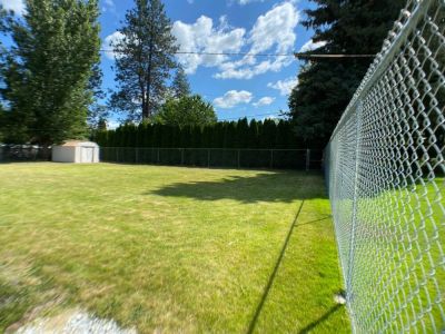 6' Chain Link Fence  fully encloses the private backyard.