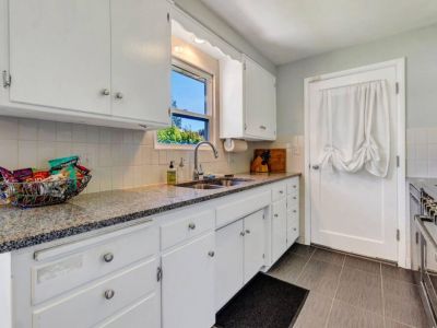 Prepare to be captivated by our newly remodeled kitchen, boasting exquisite granite countertops that add a touch of timeless elegance.