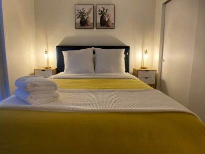 A restful haven as our queen bed beckons with unparalleled comfort and tranquility.