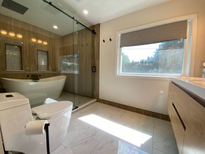 En Suite Bathroom-the ultimate luxury! Double vanities. Wet Room with a Freestanding Soaking Tub, Rain Head Shower System, and marble floors.
