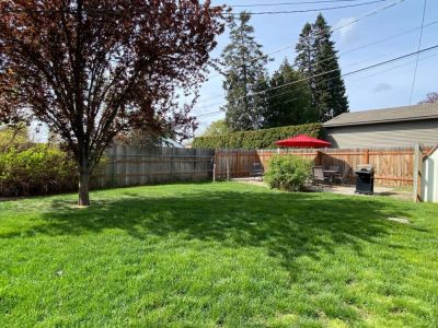 The spacious backyard is fully fenced-great for kids and pets to play