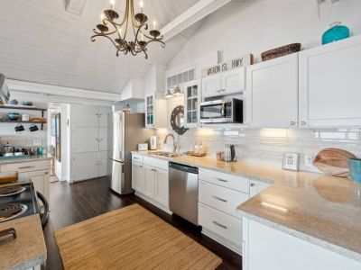 This pristine space is a minimalist's dream, with sleek lines and a bright, airy ambiance that creates an atmosphere of sophistication and functionality.
