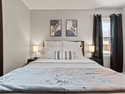 Slumber in Queen comfort with extra pillows and blankets.