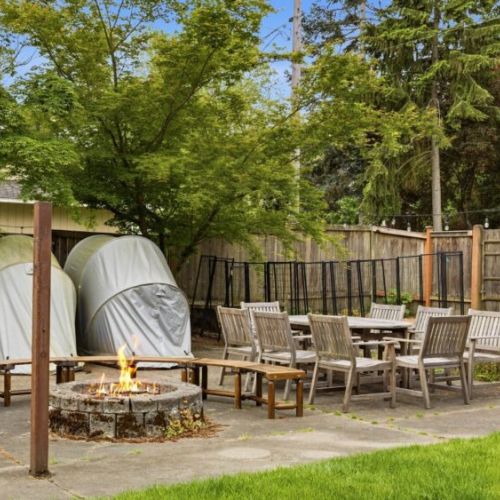The outdoor fire pit has 4 moveable curved benches to enjoy the warmth