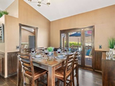 Gather and dine in style in this elegant dining room, showcasing a beautiful table and chairs set for a memorable dining experience.