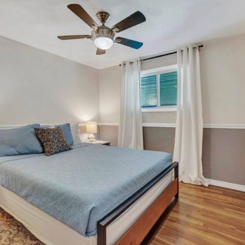 Experience comfort and coziness with an array of plush pillows and soft blankets in our inviting queen bedroom. It's equipped with a smart TV, providing entertainment and relaxation at your fingertips.