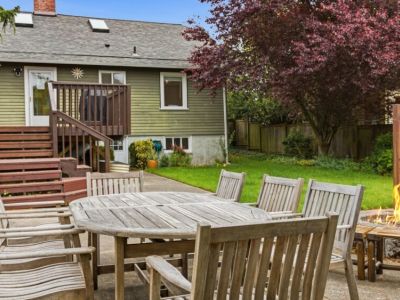 Dine al fresco while gathered around the aged teak outdoor dining-seats 8