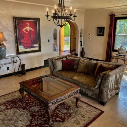 Radient heated travertine floors throughout this large living room makes family and friends movie night cozy and warm.