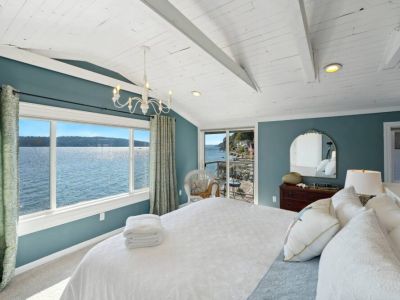 The décor is a symphony of soothing blues and neutral tones, with coastal-inspired accents that mirror the beauty of the sea.