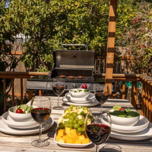 Dine al fresco! There is plenty of room for everyone to sit at the table on the deck or the shady patio table in the yard.