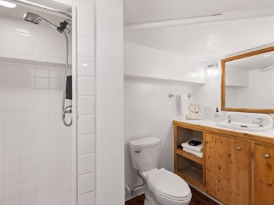 Lower-level half bath is conveniently located near the queen bedroom.
