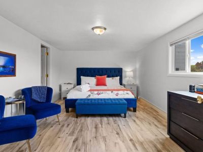 King bedroom with sitting area is tucked away in the lower level just off of the game room.