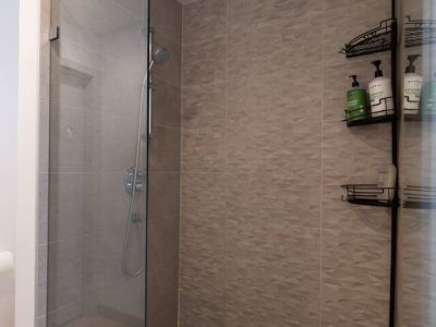 Every day is a spa day with a rain shower. The Bidet and Walk-in Closet are to the left ofthe shower.