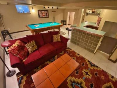 Large lower level game room has plenty of board games + pool table to keep teens and adults entertained. Comfortable queen sleeper sofa provides additioanl sleeping arrangements.
