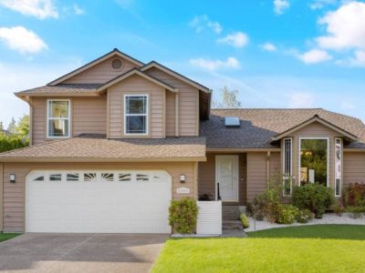Welcome to Urban Retreat! A dream home, showcasing a stunning front view that exudes charm and appeal. The inviting entryway, adorned with lush landscaping and a welcoming porch, sets the stage for a warm and inviting atmosphere that awaits inside.